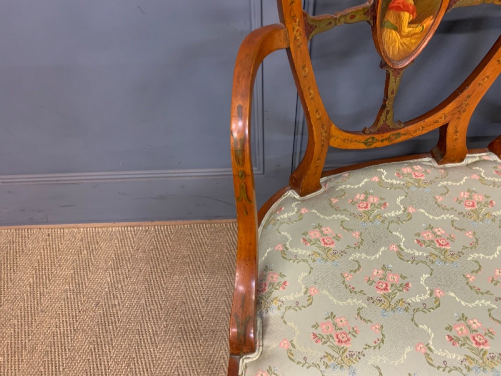 A painted satinwood three-seat settee with central portrait medallions and a light green floral upholstered cushion. View III
