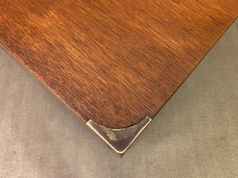 A Victorian teak two-part military campaign chest featuring flush brass handles, brass corner brackets, and turned legs. View XIV