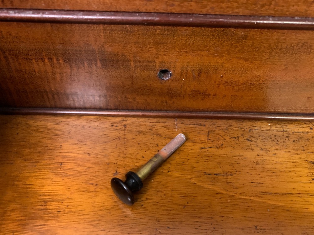 An early Victorian mahogany Davenport desk with a sloped leather writing surface and side drawers. View XI