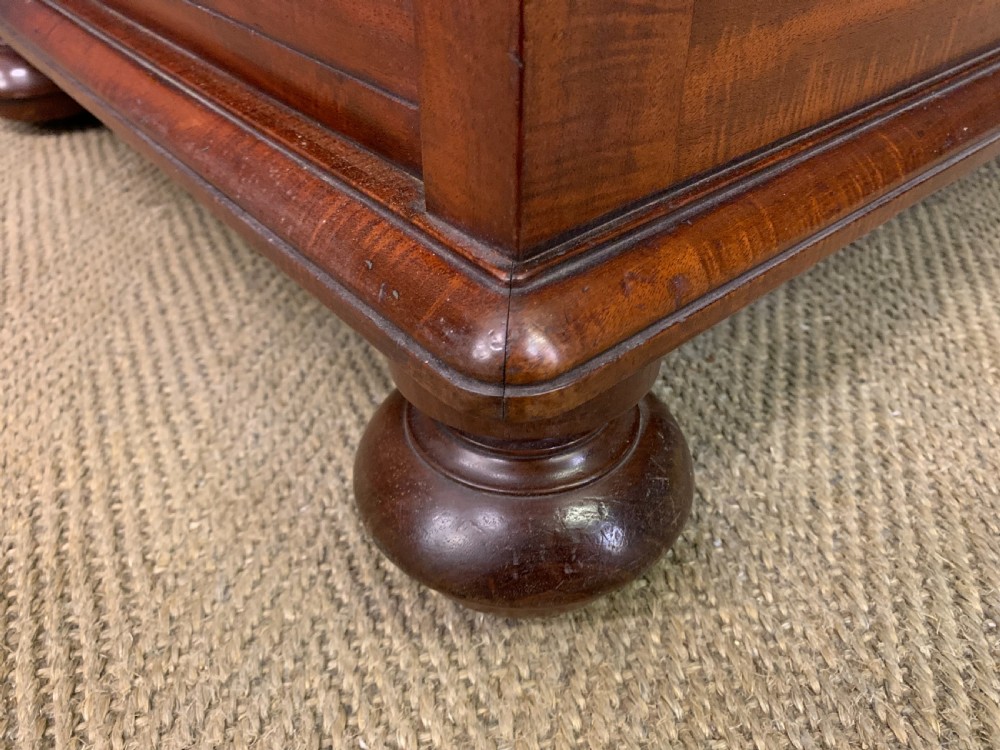 An early Victorian mahogany Davenport desk with a sloped leather writing surface and side drawers. View XXII