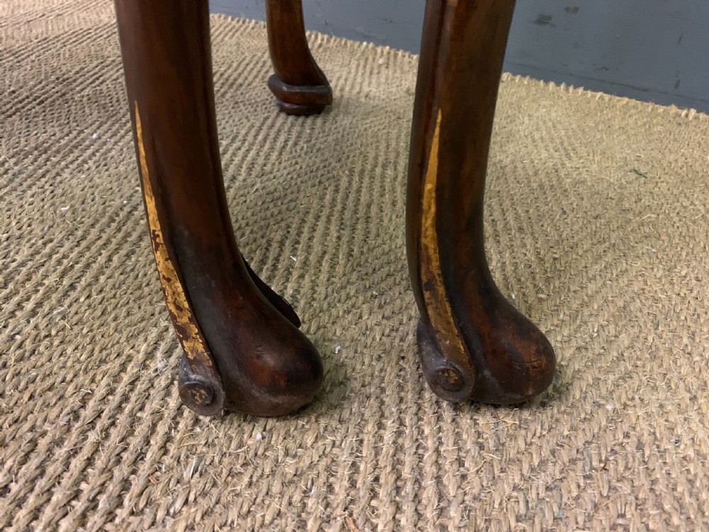 A burr walnut drop flap table featuring carved cabriole legs with leaf decoration, a single drawer with brass pull, and two rounded drop leaves. View XVI