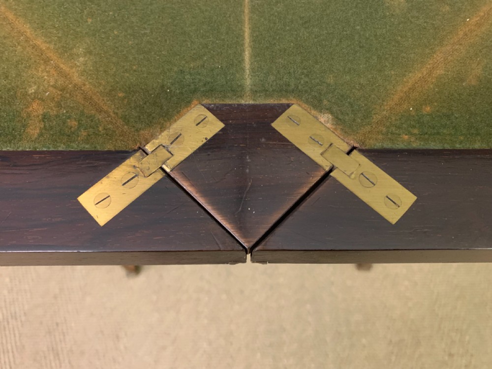 An Edwardian inlaid rosewood envelope card table featuring cabriole legs with brass mounts, a single drawer, and top flaps decorated with floral and musical instrument marquetry. View XVIII