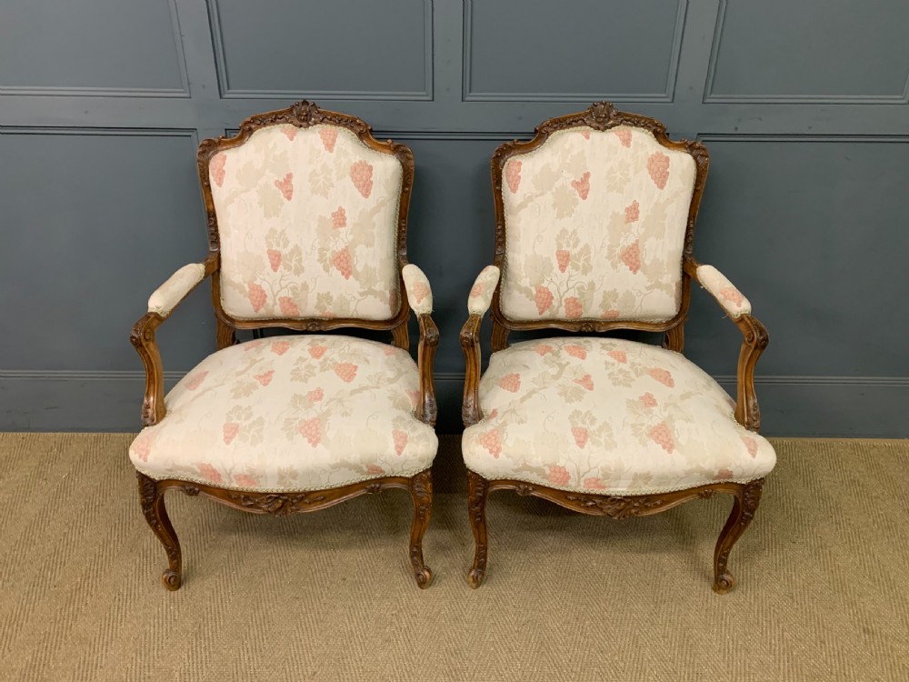 Pair of French Carved Walnut Armchairs