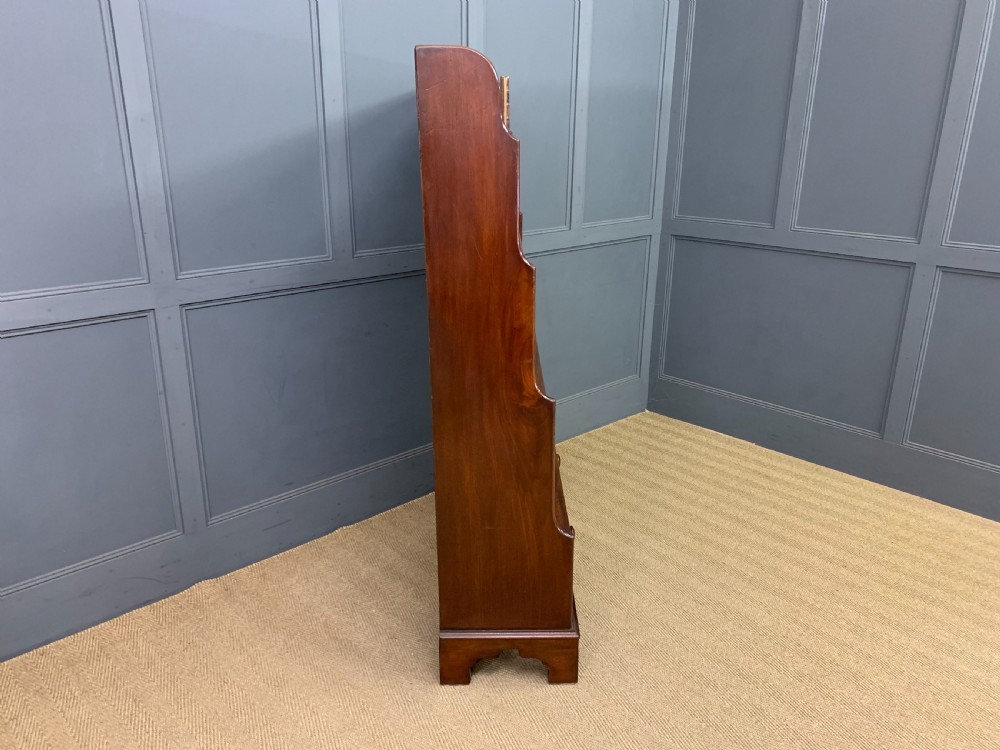 Victorian mahogany waterfall open bookcase featuring graduated shelves, shaped sides, and two lower drawers with turned wooden handles. View VIII