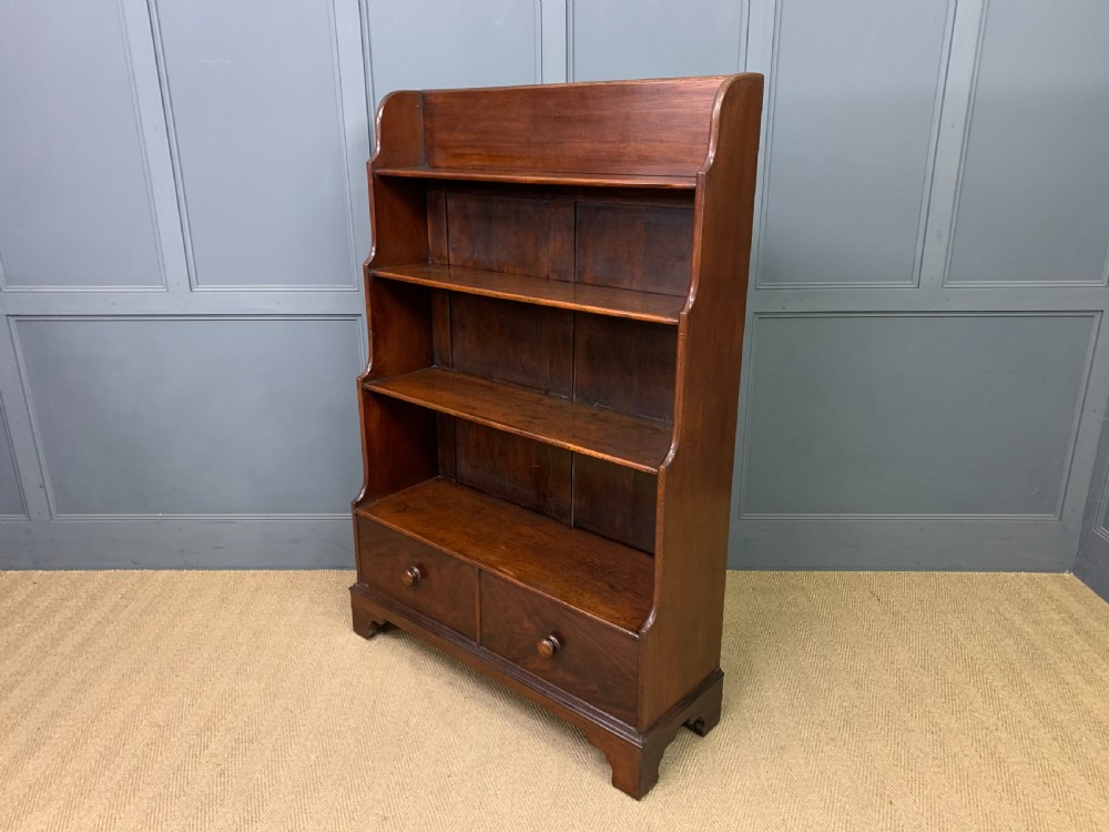 Victorian mahogany waterfall open bookcase featuring graduated shelves, shaped sides, and two lower drawers with turned wooden handles. View XIV
