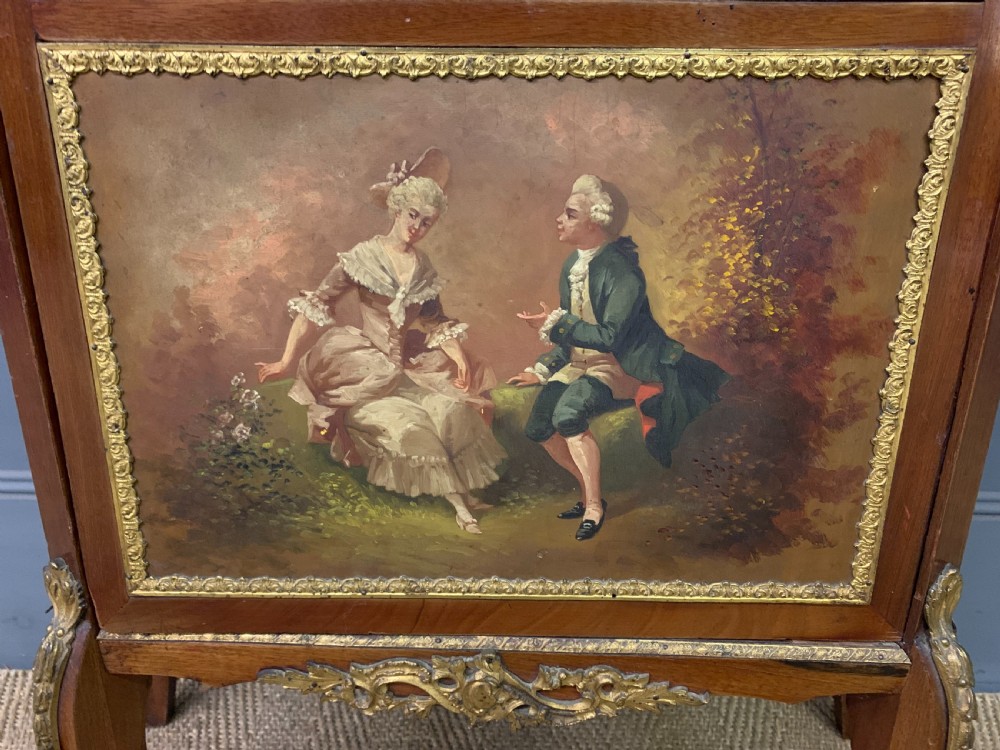 A French Louis XV style mahogany vitrine featuring a curved glazed door, gilt-bronze mounts, hand-painted lower panel depicting romantic figures, and a red velvet interior. View VIII