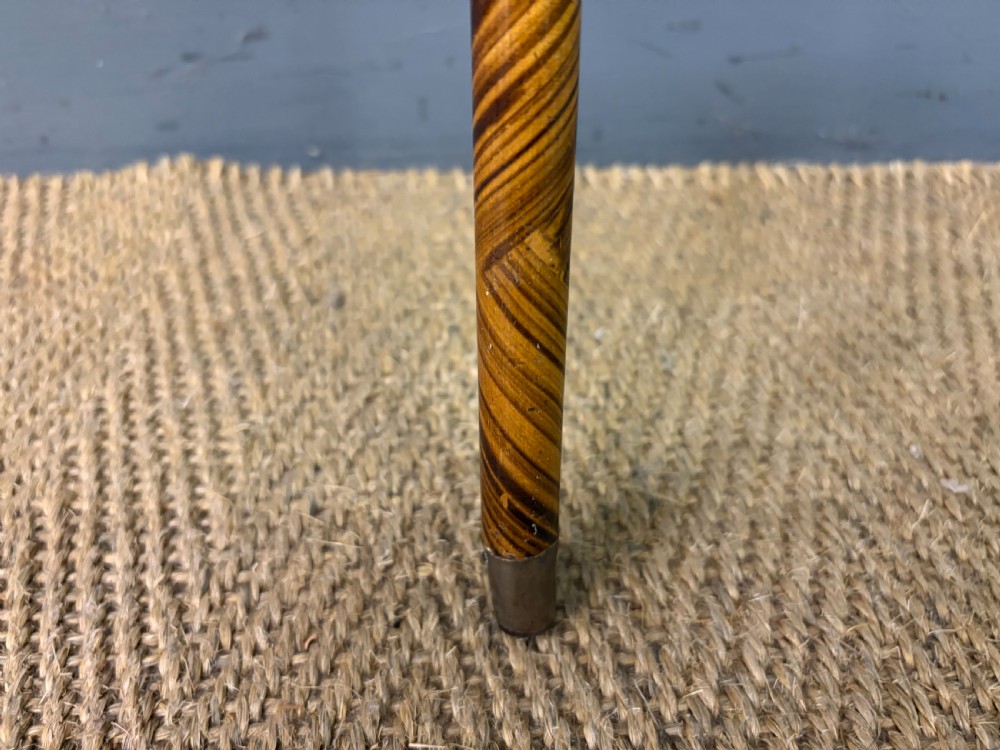 A Victorian wooden walking cane featuring a spiral pattern along the tapered shaft and a metal collar. View III