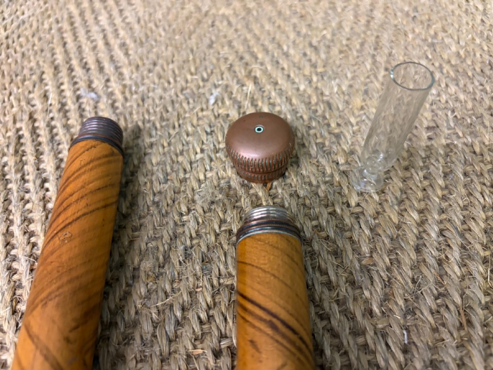 A Victorian wooden walking cane featuring a spiral pattern along the tapered shaft and a metal collar. View VII