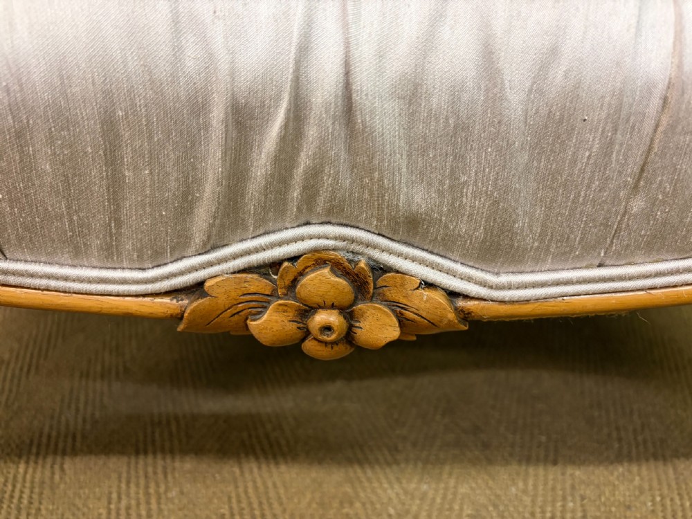 A large rectangular Victorian rosewood stool with deep-buttoned cream upholstery and carved cabriole legs. View VII