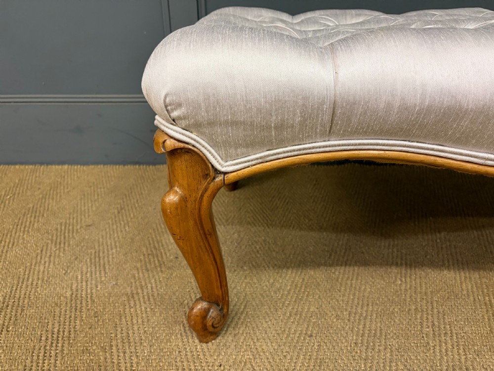 A large rectangular Victorian rosewood stool with deep-buttoned cream upholstery and carved cabriole legs. View VIII