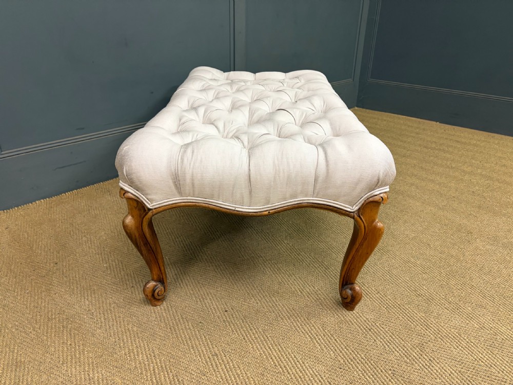 A large rectangular Victorian rosewood stool with deep-buttoned cream upholstery and carved cabriole legs. View XI