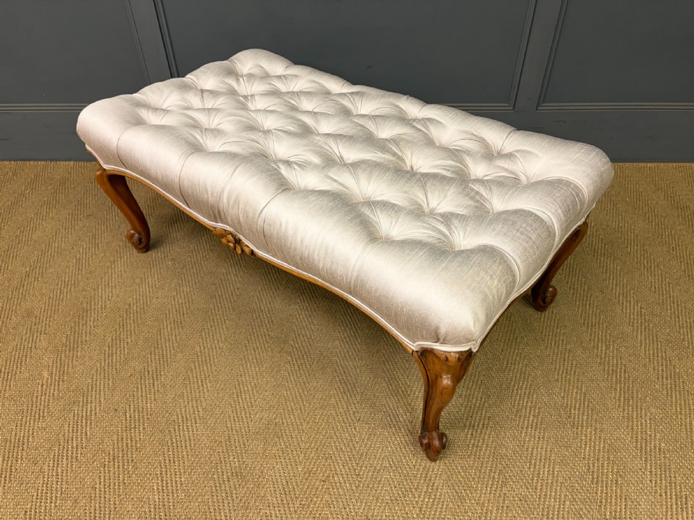 A large rectangular Victorian rosewood stool with deep-buttoned cream upholstery and carved cabriole legs. View XII