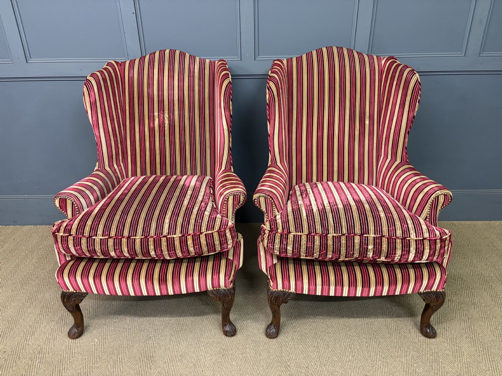 A pair of high-backed wing armchairs upholstered in red and gold striped velvet fabric with carved timber cabriole legs. View III