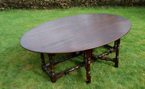 EARLY 20TH CENTURY OAK OVAL WAKE DINING TABLE - ADDITIONAL PHOTO 1