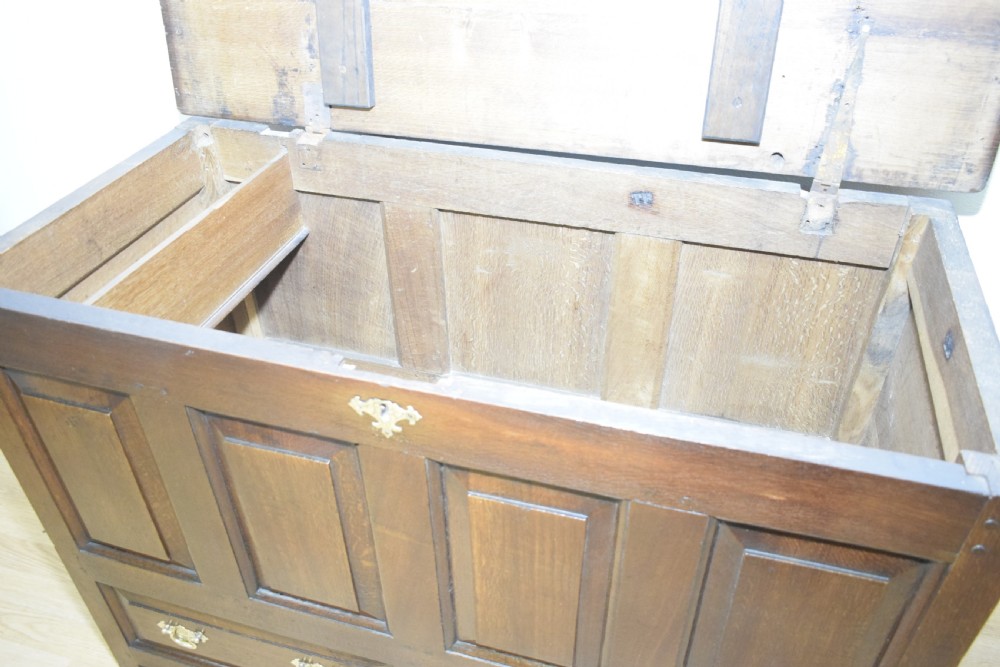 A dark Georgian oak mule chest featuring four fielded front panels and two lower drawers with brass swan-neck handles. View XIII