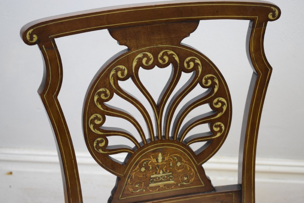 A pair of Victorian side chairs featuring dark mahogany frames with detailed marquetry inlays, fan-shaped pierced backrests, and cream upholstered seats. View XV