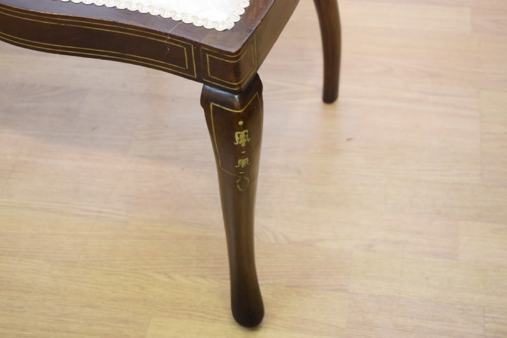 A pair of Victorian side chairs featuring dark mahogany frames with detailed marquetry inlays, fan-shaped pierced backrests, and cream upholstered seats. View XVII