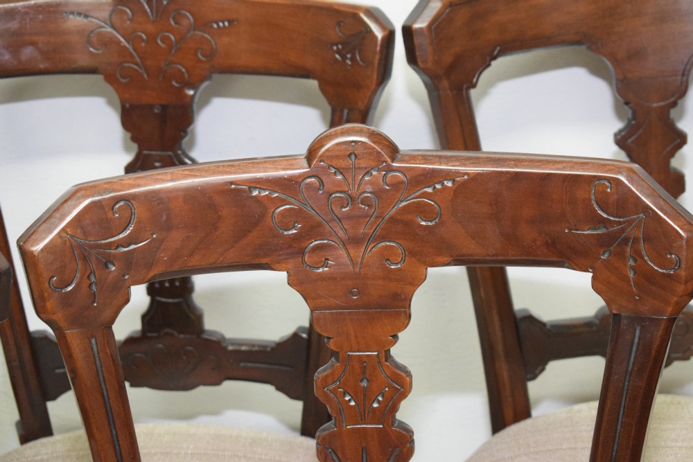 A set of six Victorian mahogany dining chairs featuring carved open backs, turned front legs, and neutral upholstered seats. View XVII