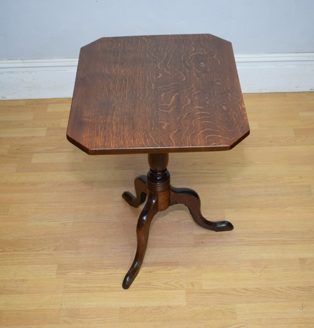 A Georgian oak tripod table with a rectangular top featuring canted corners, a turned pedestal stem, and three downswept legs. View IX