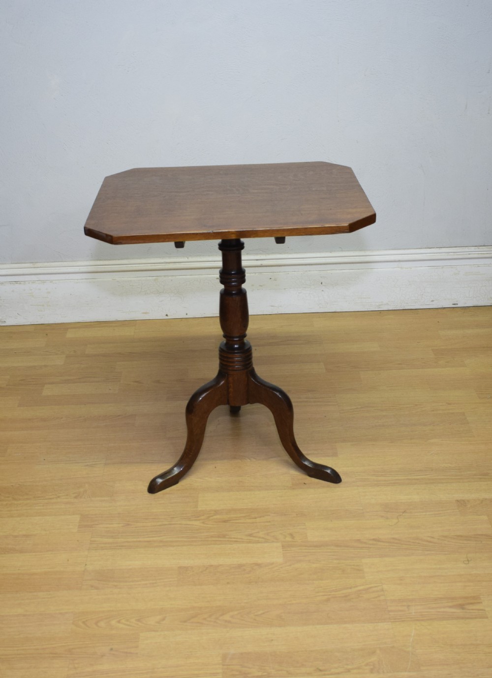 A Georgian oak tripod table with a rectangular top featuring canted corners, a turned pedestal stem, and three downswept legs. View XIII