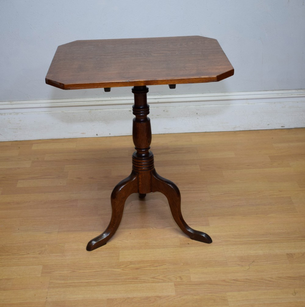 A Georgian oak tripod table with a rectangular top featuring canted corners, a turned pedestal stem, and three downswept legs. View XV