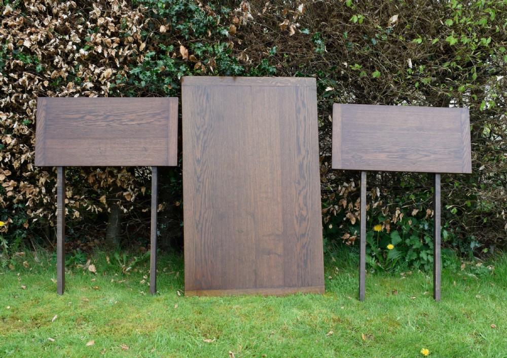 An early 20th-century dark oak refectory dining table featuring turned bulbous legs, a low central stretcher, and a rectangular wooden top. View XXIV