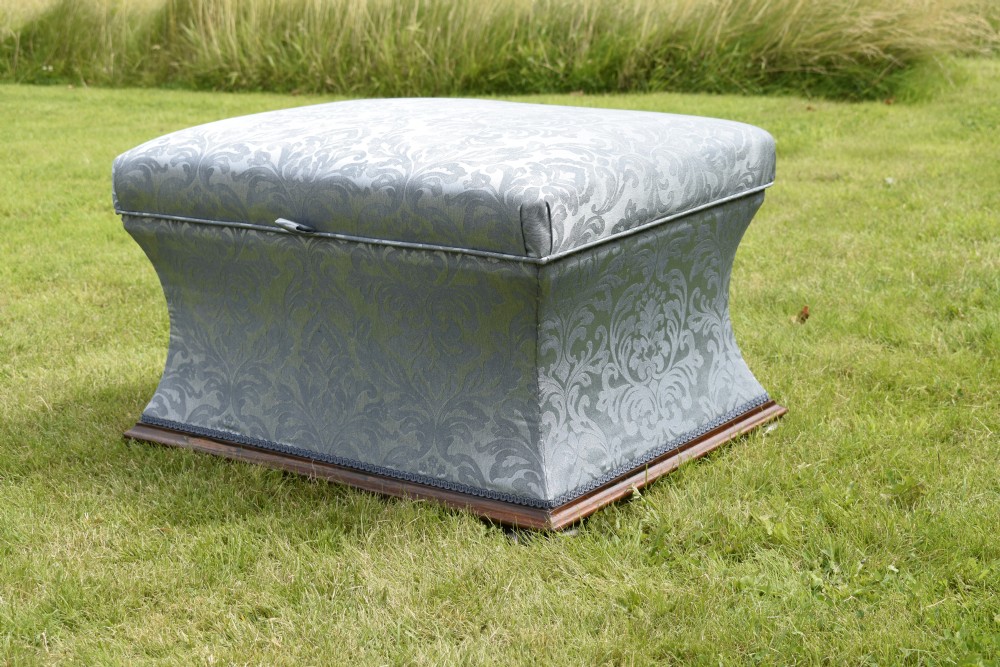 A Regency sarcophagus-shaped ottoman upholstered in blue and silver damask fabric set upon a rosewood plinth base. View VII