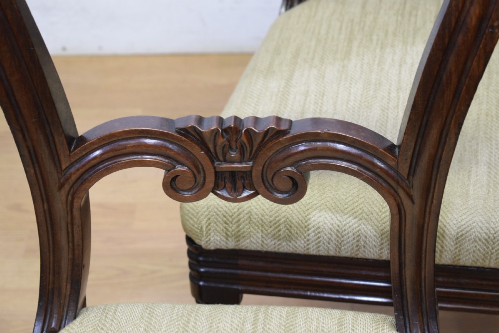 Set of three Scottish Regency mahogany dining chairs featuring carved crest rails, scrolled open backs, turned front legs, and pale green upholstered seats. View XIV