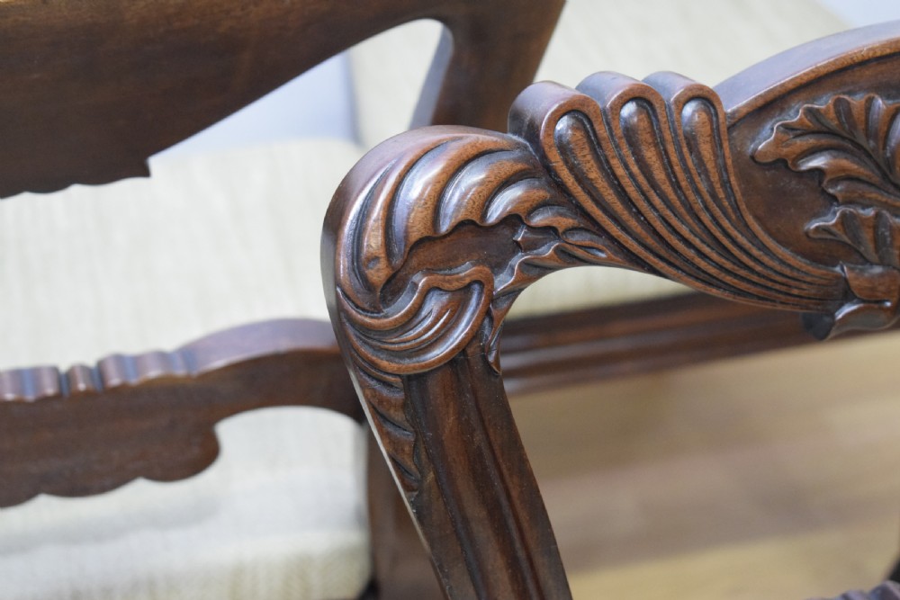 Set of three Scottish Regency mahogany dining chairs featuring carved crest rails, scrolled open backs, turned front legs, and pale green upholstered seats. View XXIII