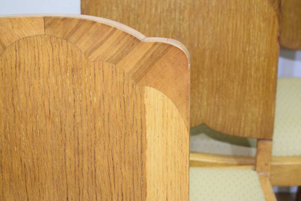 An Art Deco light oak dining suite featuring a shaped table with a central pedestal surrounded by four matching upholstered chairs. View XIII