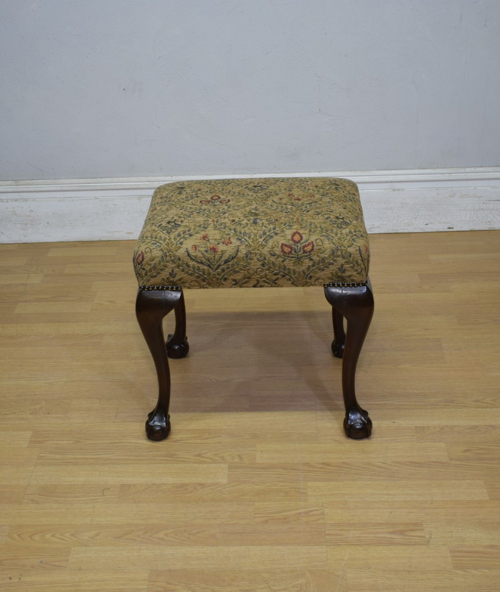 A square Chippendale style stool upholstered in floral patterned fabric with dark mahogany cabriole legs and claw-and-ball feet. View VIII