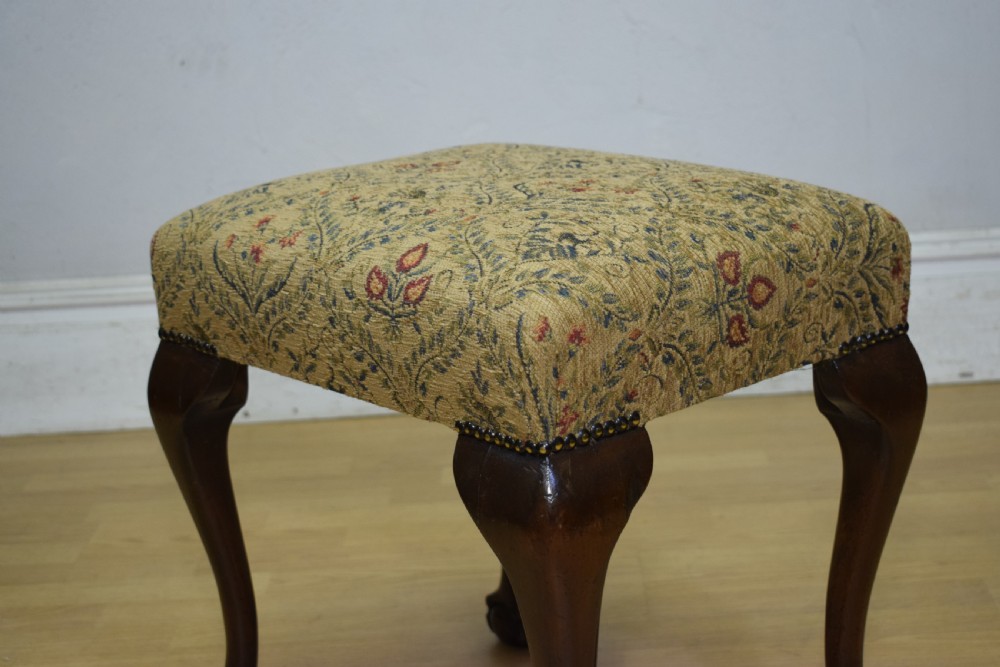 A square Chippendale style stool upholstered in floral patterned fabric with dark mahogany cabriole legs and claw-and-ball feet. View XI