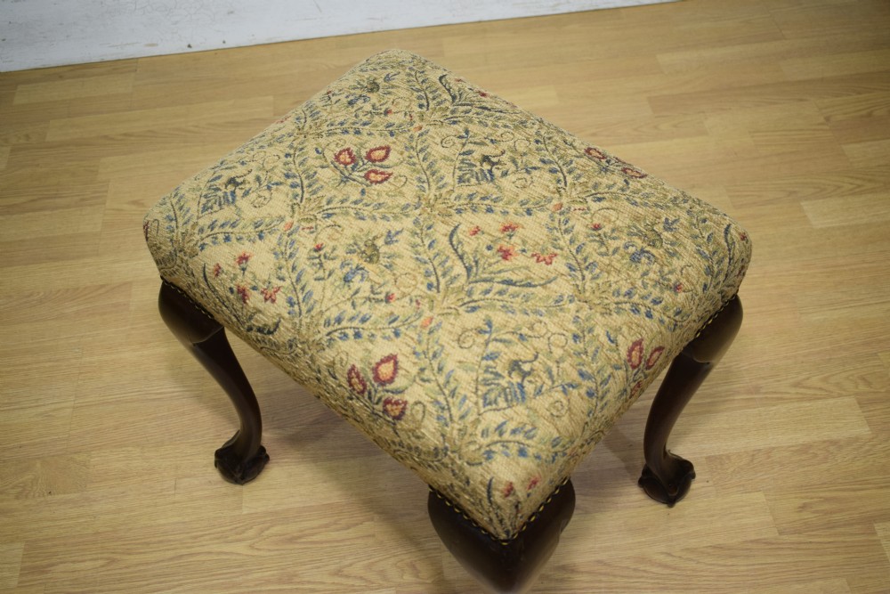 A square Chippendale style stool upholstered in floral patterned fabric with dark mahogany cabriole legs and claw-and-ball feet. View XII
