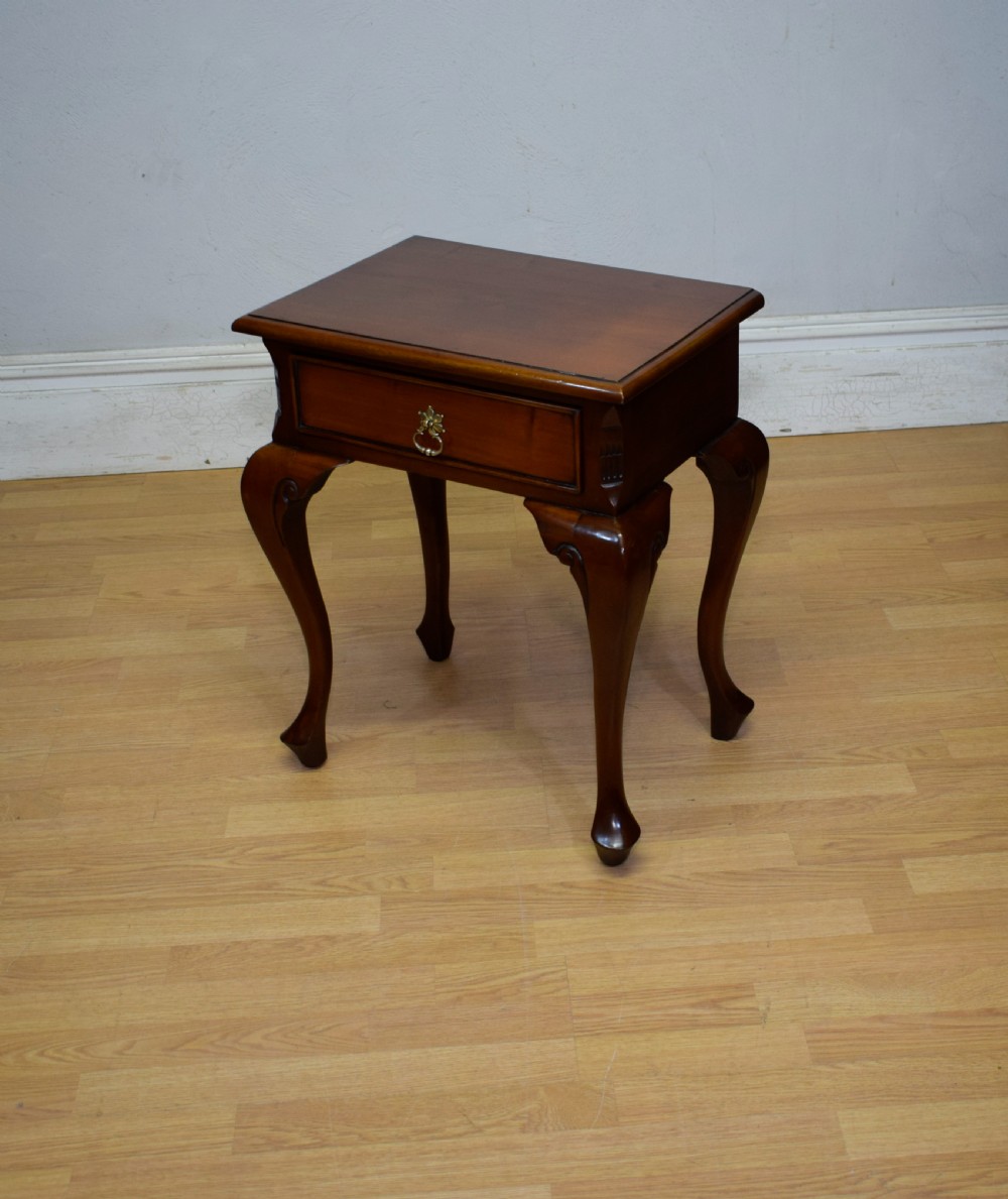 An early 20th-century mahogany lamp table featuring a single drawer with a brass drop ring handle and four cabriole legs ending in pad feet. View II
