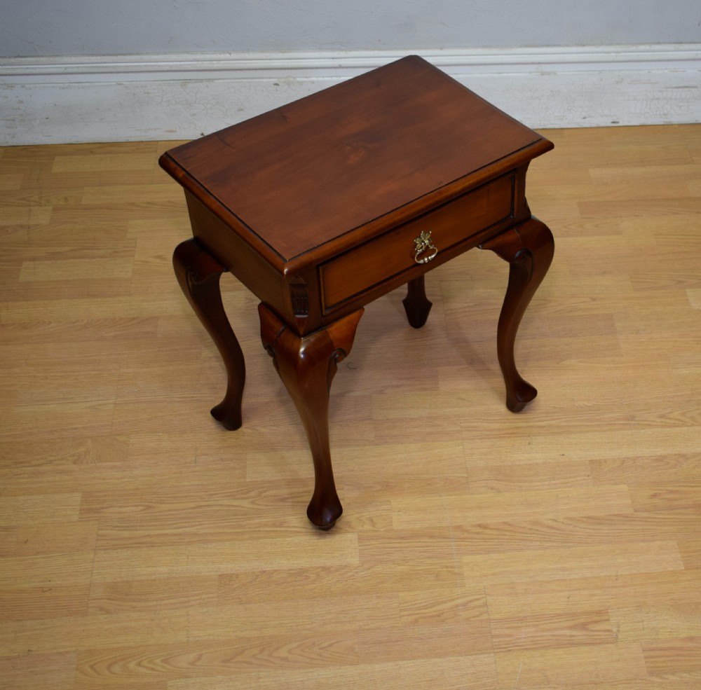 An early 20th-century mahogany lamp table featuring a single drawer with a brass drop ring handle and four cabriole legs ending in pad feet. View III