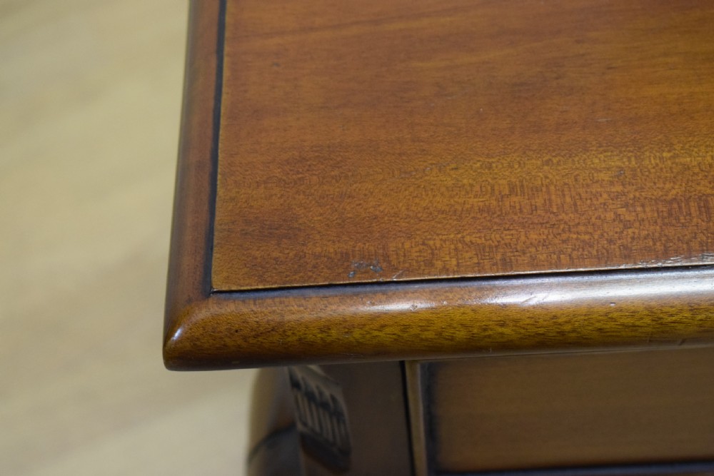 An early 20th-century mahogany lamp table featuring a single drawer with a brass drop ring handle and four cabriole legs ending in pad feet. View XIII