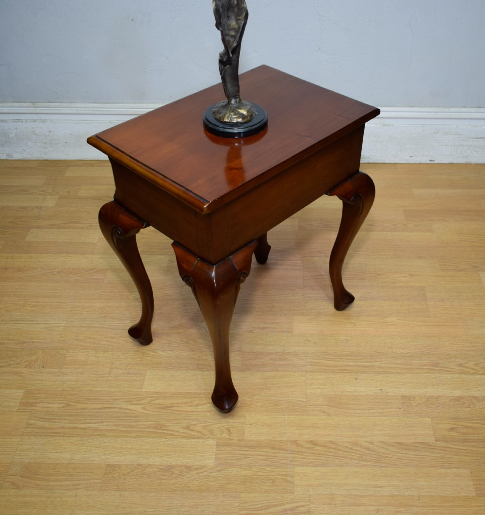 An early 20th-century mahogany lamp table featuring a single drawer with a brass drop ring handle and four cabriole legs ending in pad feet. View XIV