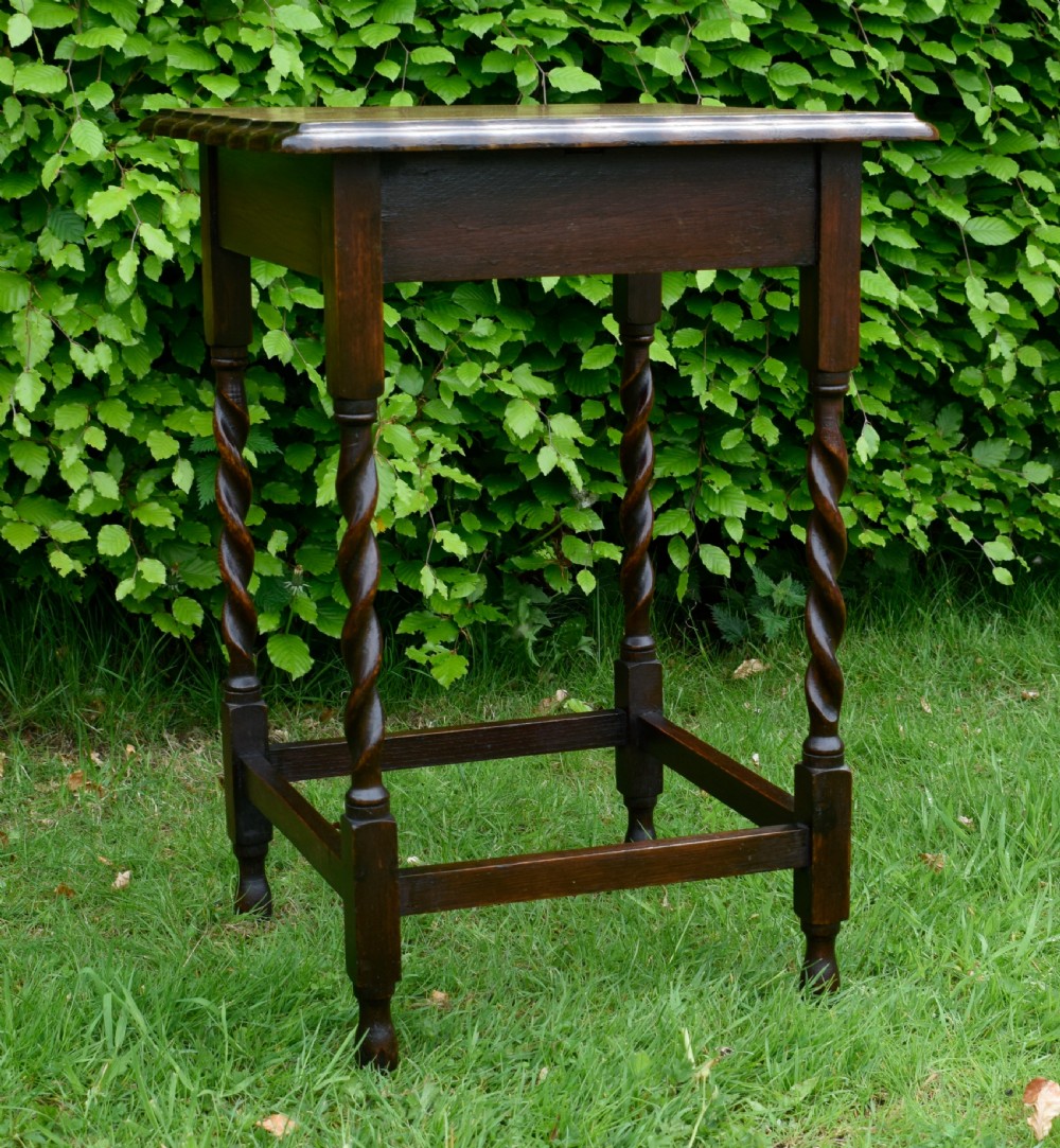 A dark brown square oak side table featuring a scalloped piecrust edge, four barley twist turned legs, and a lower square stretcher frame. View IX