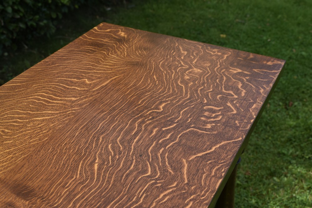 A tall rectangular dark oak side table featuring turned legs, a shaped apron, and lower perimeter box stretchers. View X