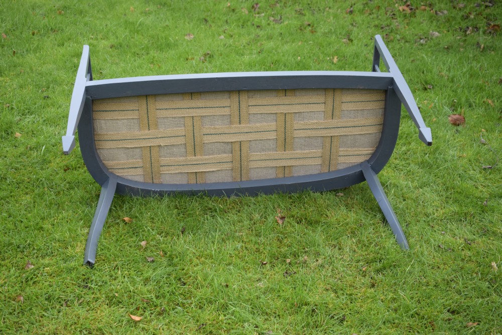 An Edwardian painted grey wooden settee featuring vertical spindles, pierced back splats, and a neutral beige velvet upholstered seat. View XIV