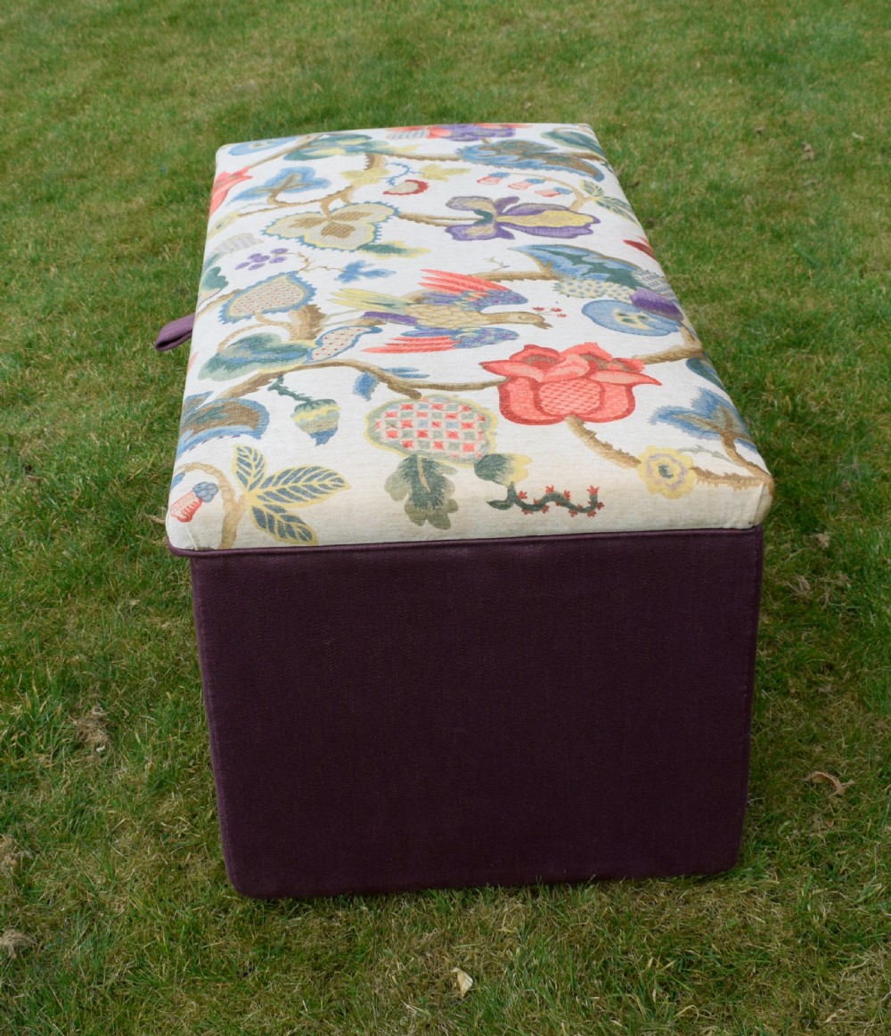A rectangular Victorian upholstered storage ottoman featuring a deep purple base and a floral patterned fabric lid. View XV