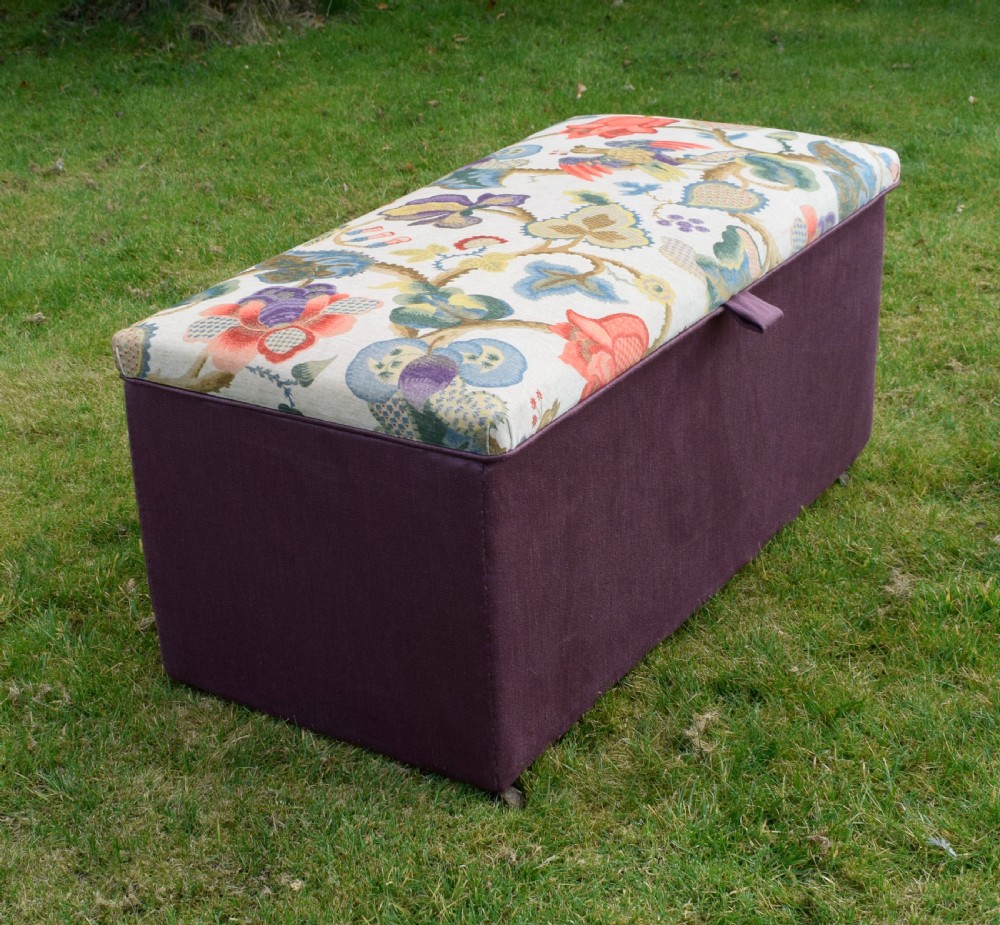 A rectangular Victorian upholstered storage ottoman featuring a deep purple base and a floral patterned fabric lid. View XVII