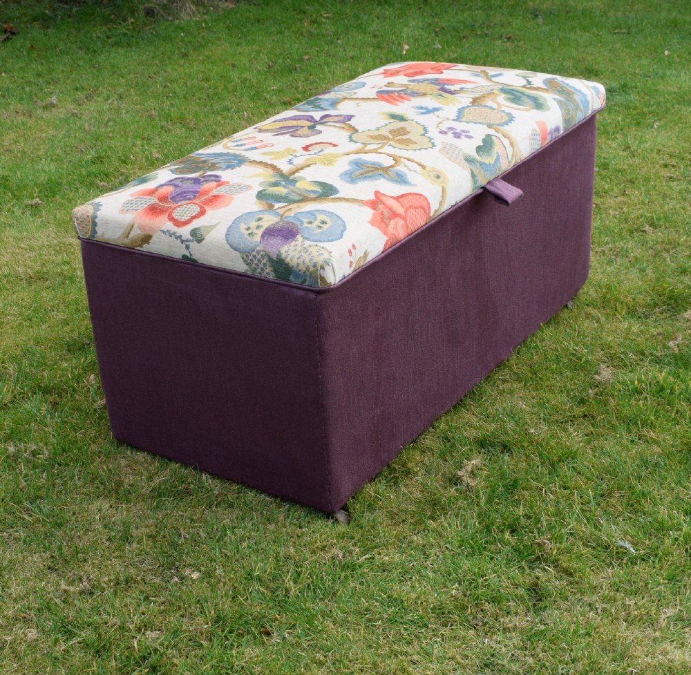 A rectangular Victorian upholstered storage ottoman featuring a deep purple base and a floral patterned fabric lid. View XVIII