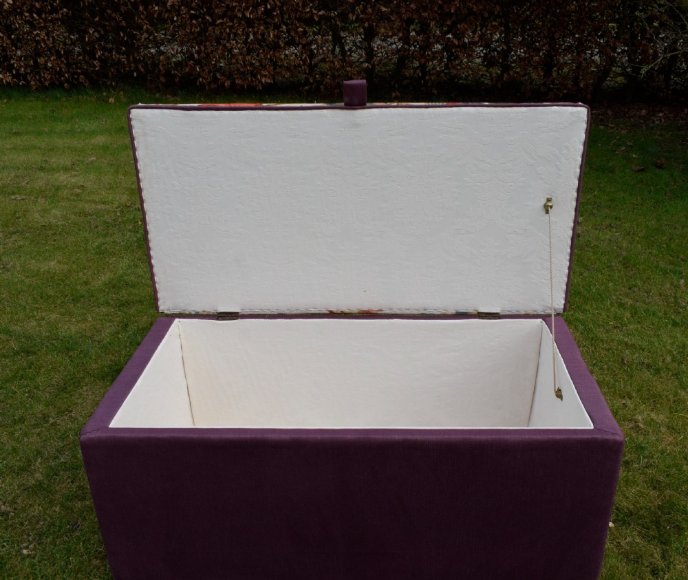 A rectangular Victorian upholstered storage ottoman featuring a deep purple base and a floral patterned fabric lid. View XXI