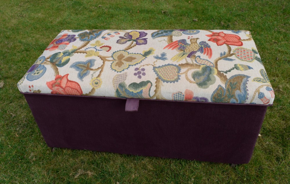 A rectangular Victorian upholstered storage ottoman featuring a deep purple base and a floral patterned fabric lid. View XXII