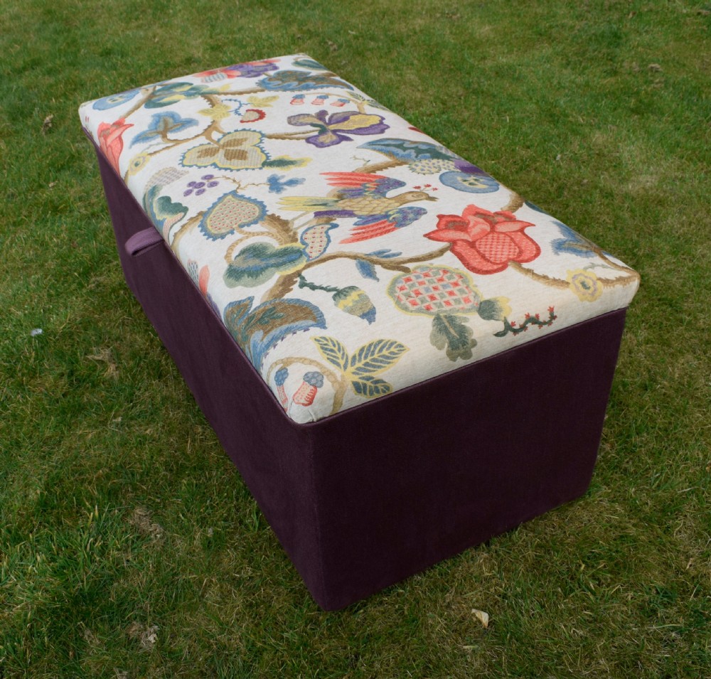 A rectangular Victorian upholstered storage ottoman featuring a deep purple base and a floral patterned fabric lid. View XXIII