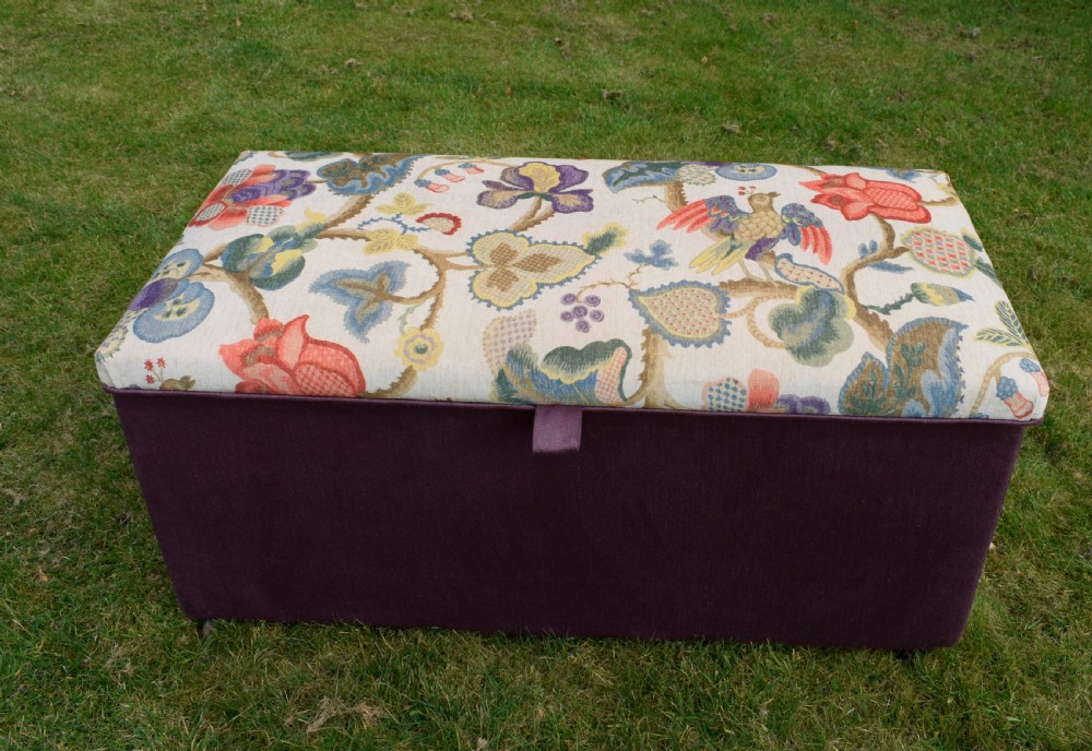 A rectangular Victorian upholstered storage ottoman featuring a deep purple base and a floral patterned fabric lid. View XXIV