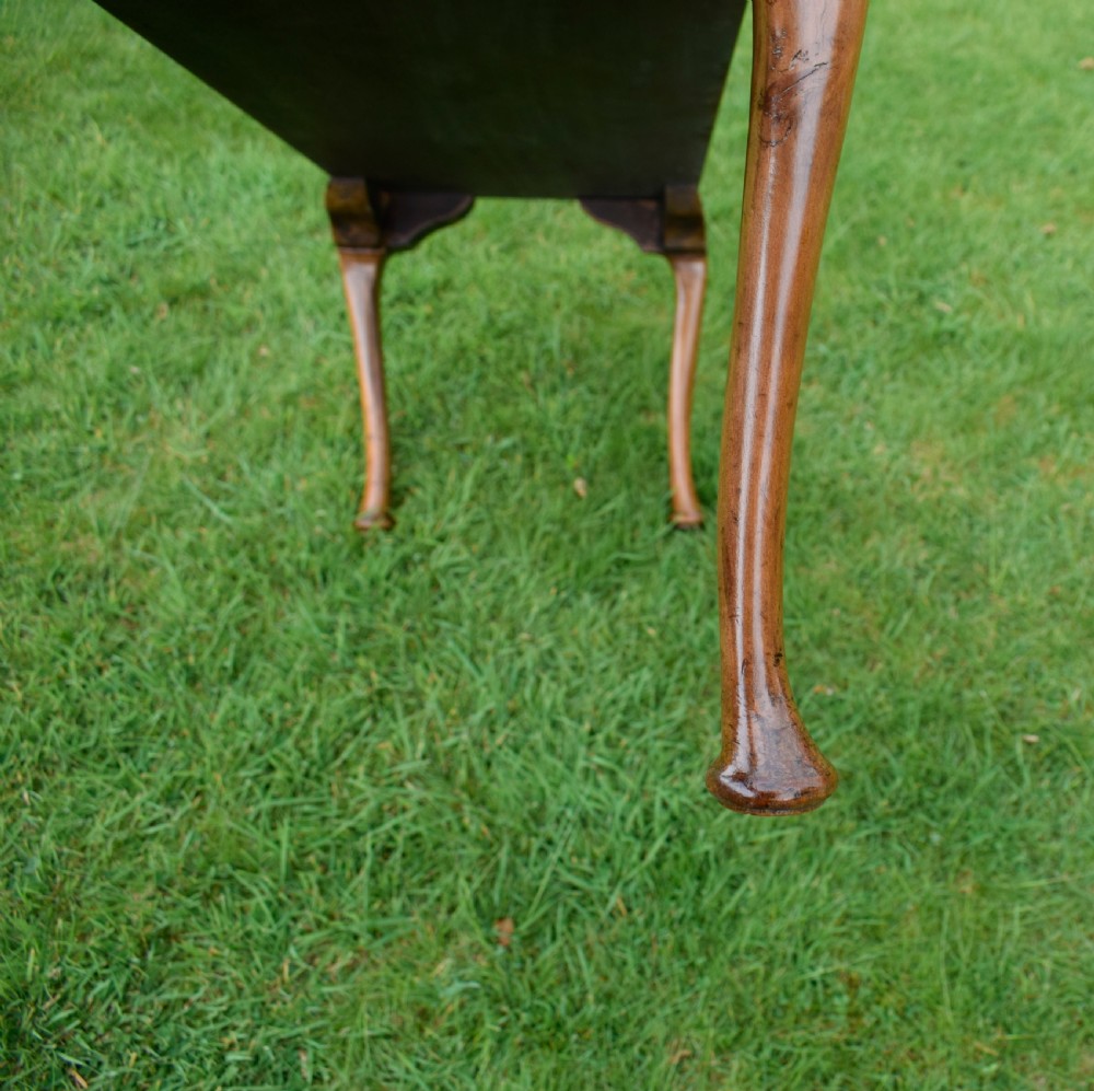 An elongated rectangular wooden duet piano stool featuring cabriole legs and a blue patterned damask upholstered seat trimmed with dark braid. View XI