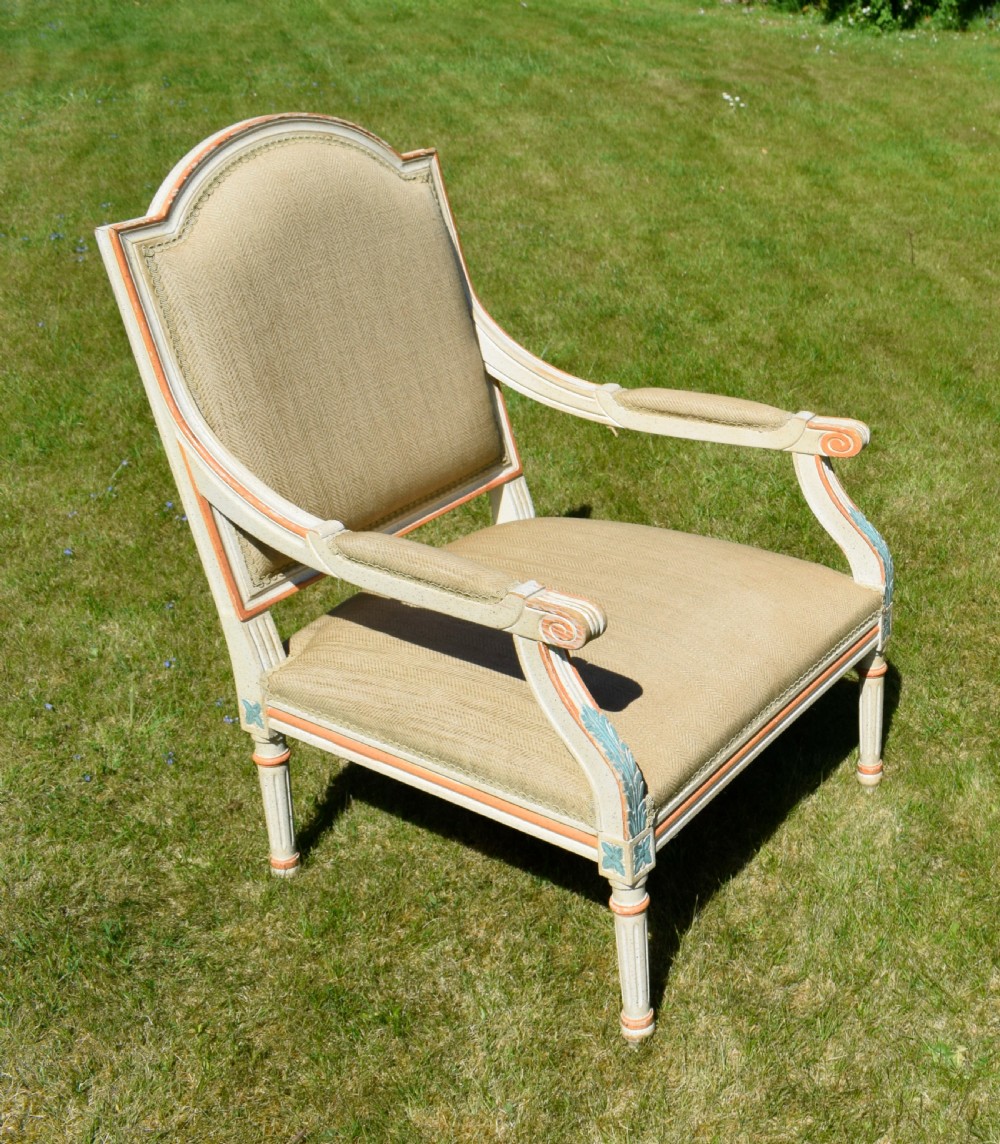 An early 20th-century French Louis XVI style fauteuil armchair featuring a painted off-white frame with fluted legs and beige herringbone fabric upholstery. View III