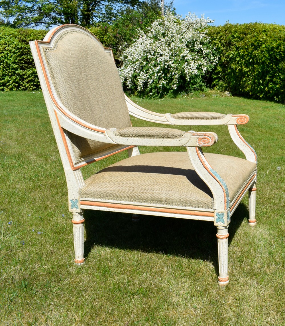 An early 20th-century French Louis XVI style fauteuil armchair featuring a painted off-white frame with fluted legs and beige herringbone fabric upholstery. View V